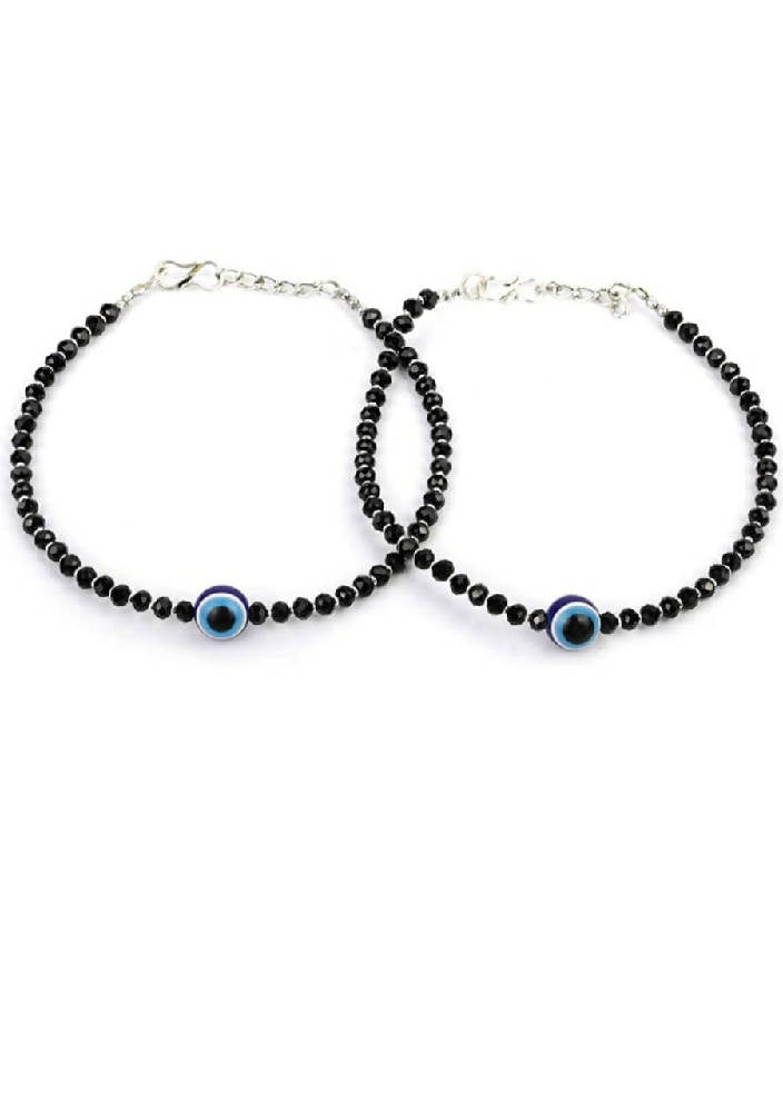 A pair of traditional silver-plated anklets featuring elegant black beads for ethnic and party wear.
