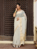 Grey cotton saree with contrasting green blouse