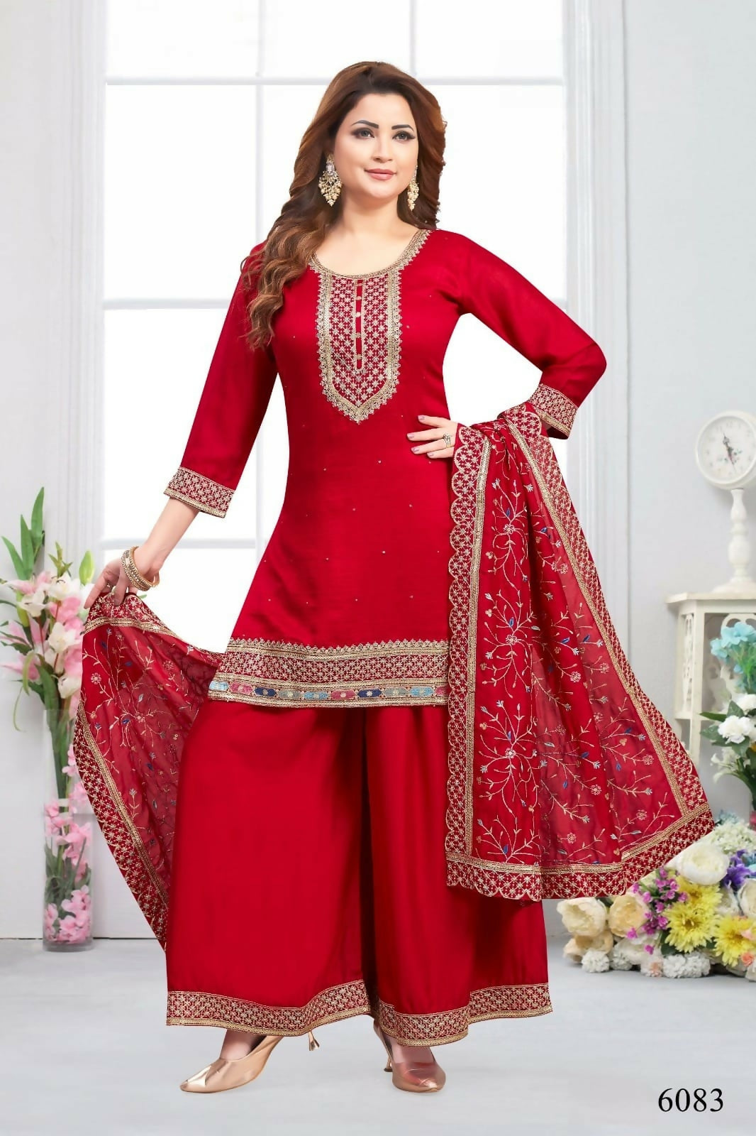 A vibrant red muslin silk 3-piece kurta set with a matching dupatta and cotton lining.