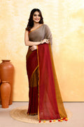 Woman wearing a multi-embellished handloom cotton saree with intricate detailing