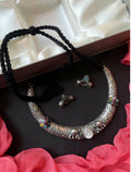 Close-up of a multi-colored Monalisa stone oxidized brass choker and matching earring set