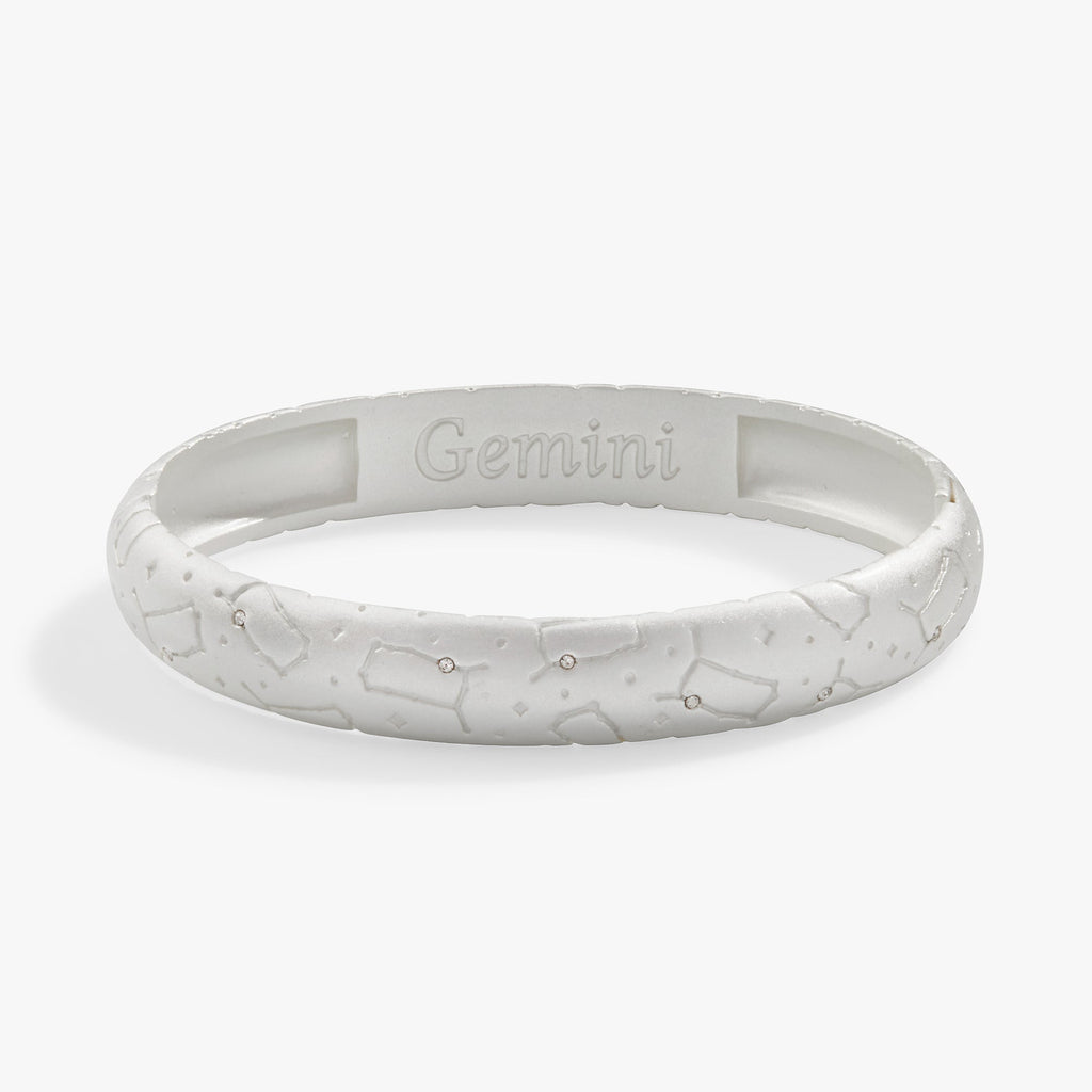 Gemini zodiac hinge bangle with crystal-studded constellation design and satin finish.