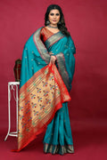 Sky Blue Paithani Silk saree with Zari woven border and red blouse piece