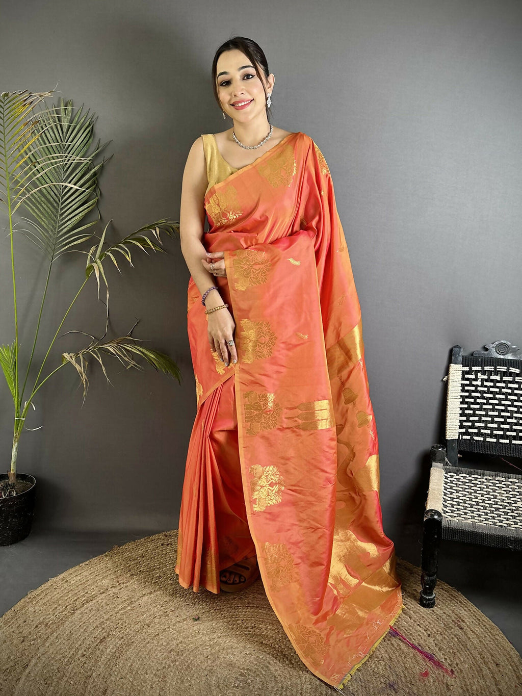 Orange Soft Silk Banarasi Saree with detailed gold Zari motifs and matching blouse piece