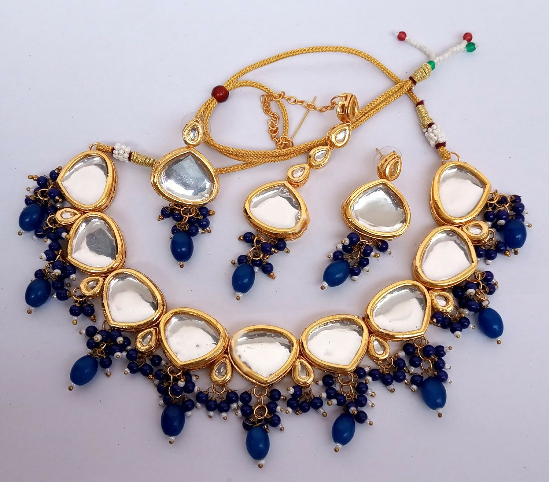 Blue Kundan work necklace set with gold plated finish and adjustable cord