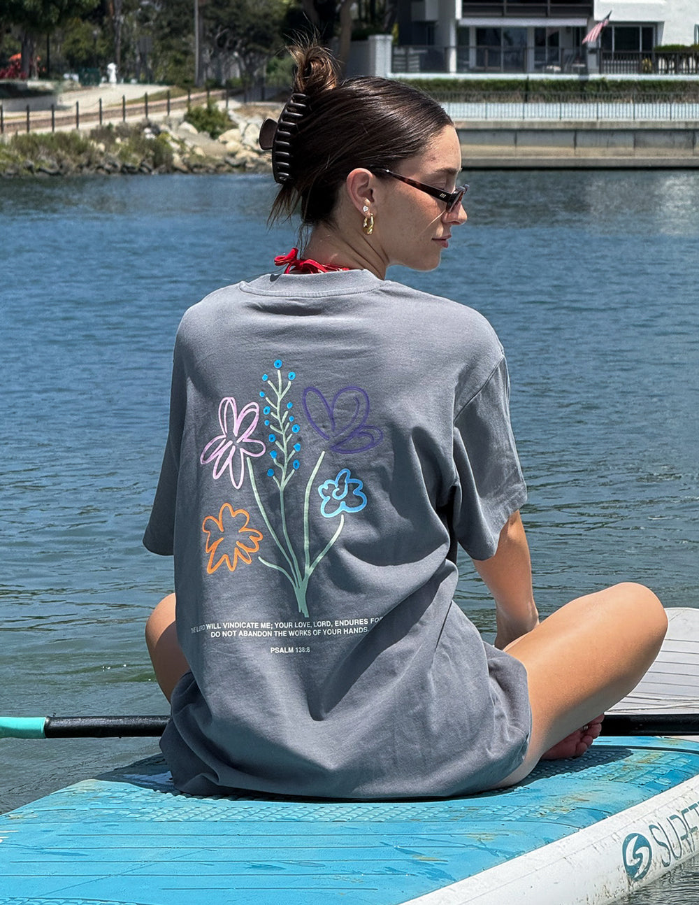 God's Still Working Unisex Graphic Tee in Charcoal Grey