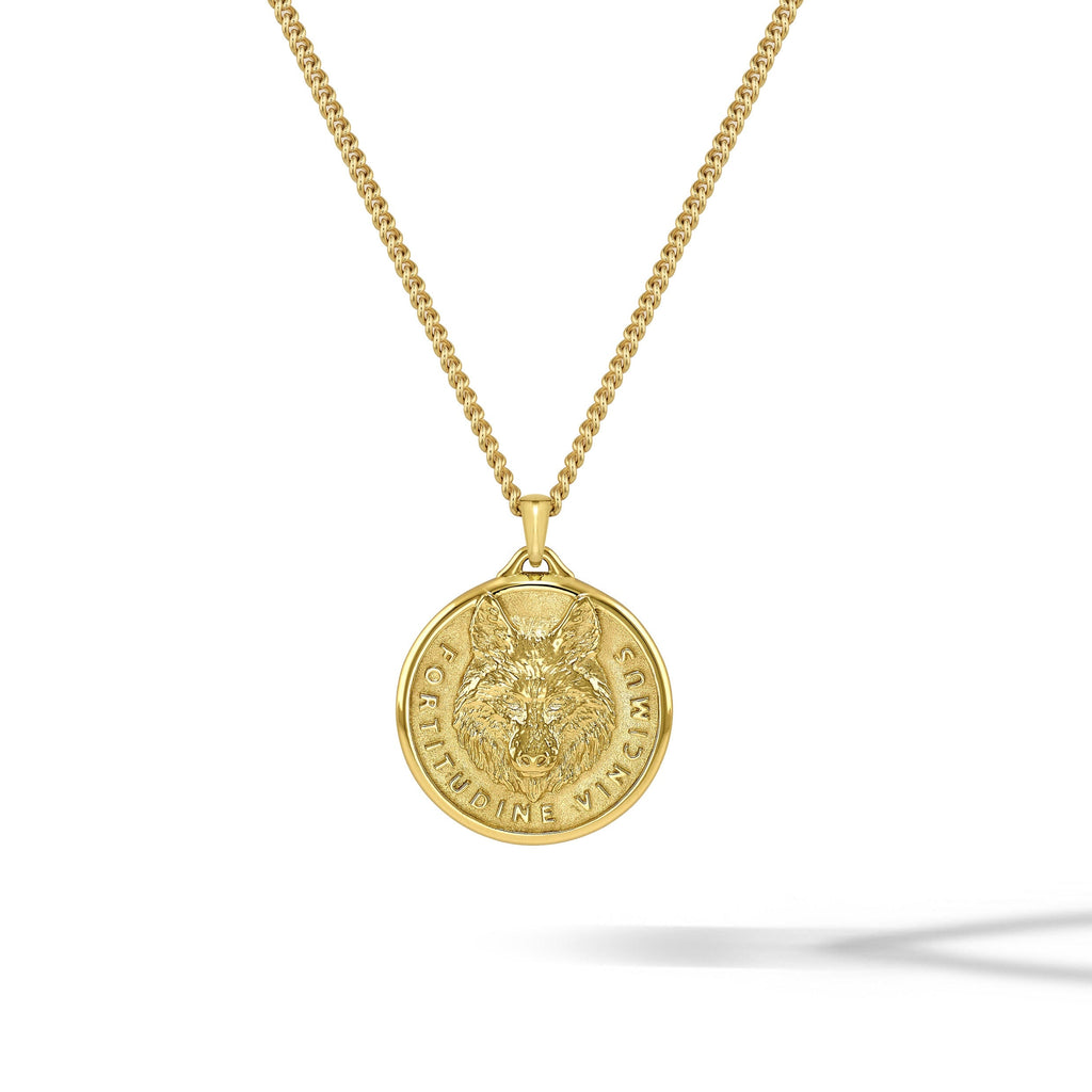 Detailed 14K gold wolf head pendant reflecting strength and craftsmanship.