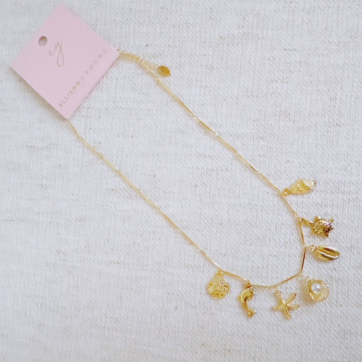 Golden Sea Charm Necklace – Shell, Dolphin & Starfish