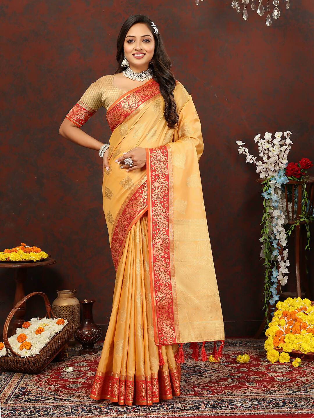 Woman wearing a Gold cotton saree with intricate Zari weaving design and matching silk blouse