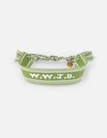 Green woven fabric bracelet with white embroidered WWJD text