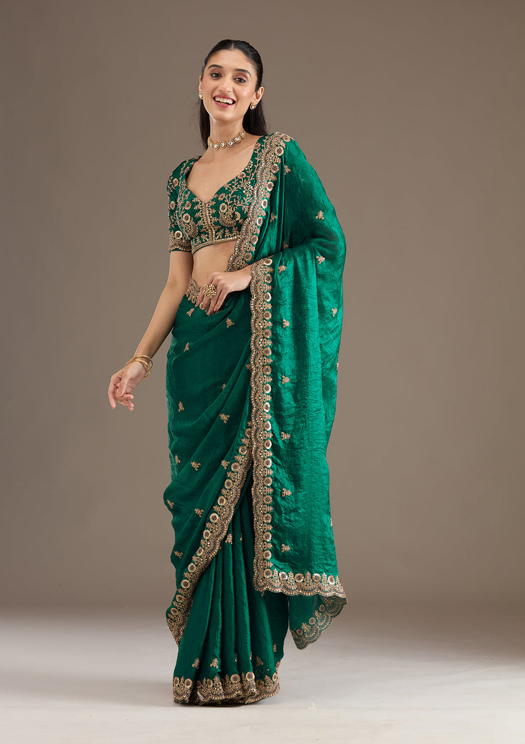 Green Fendi Satin saree featuring heavy embroidery and double sequence work