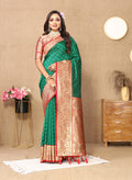 Green soft silk saree featuring intricate gold Zari weaving patterns.