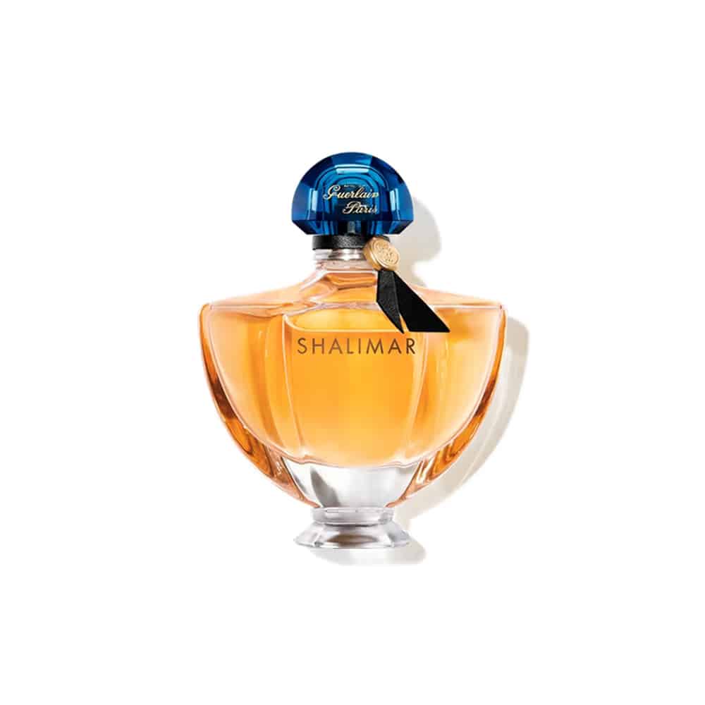 Guerlain Shalimar Eau de Parfum glass bottle with elegant blue stopper