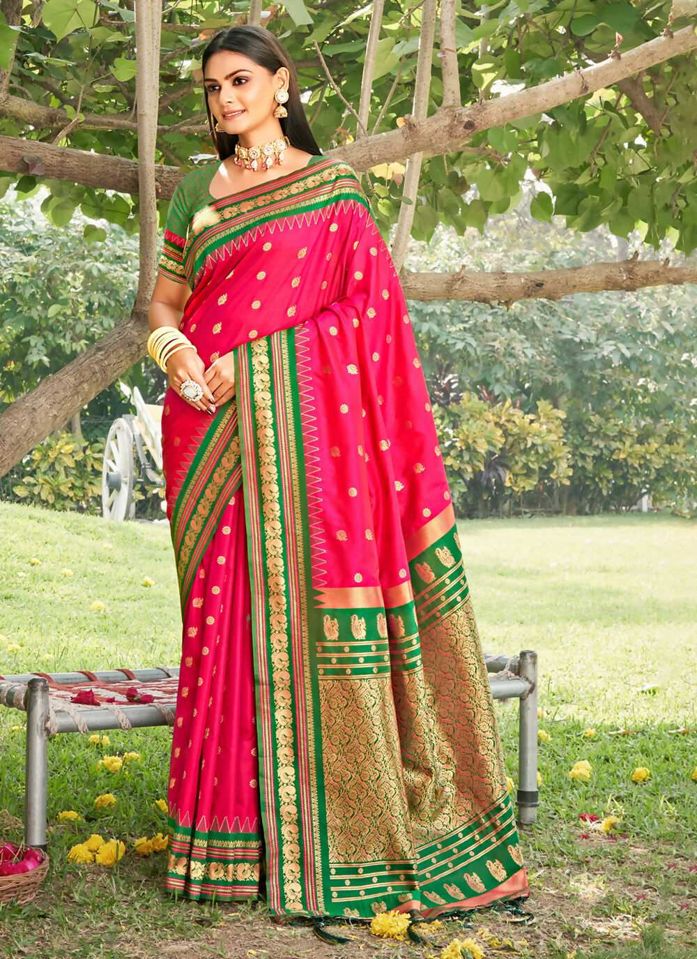 Elegant pink soft silk saree with a matching pink blouse piece, featuring a smooth and lustrous finish.