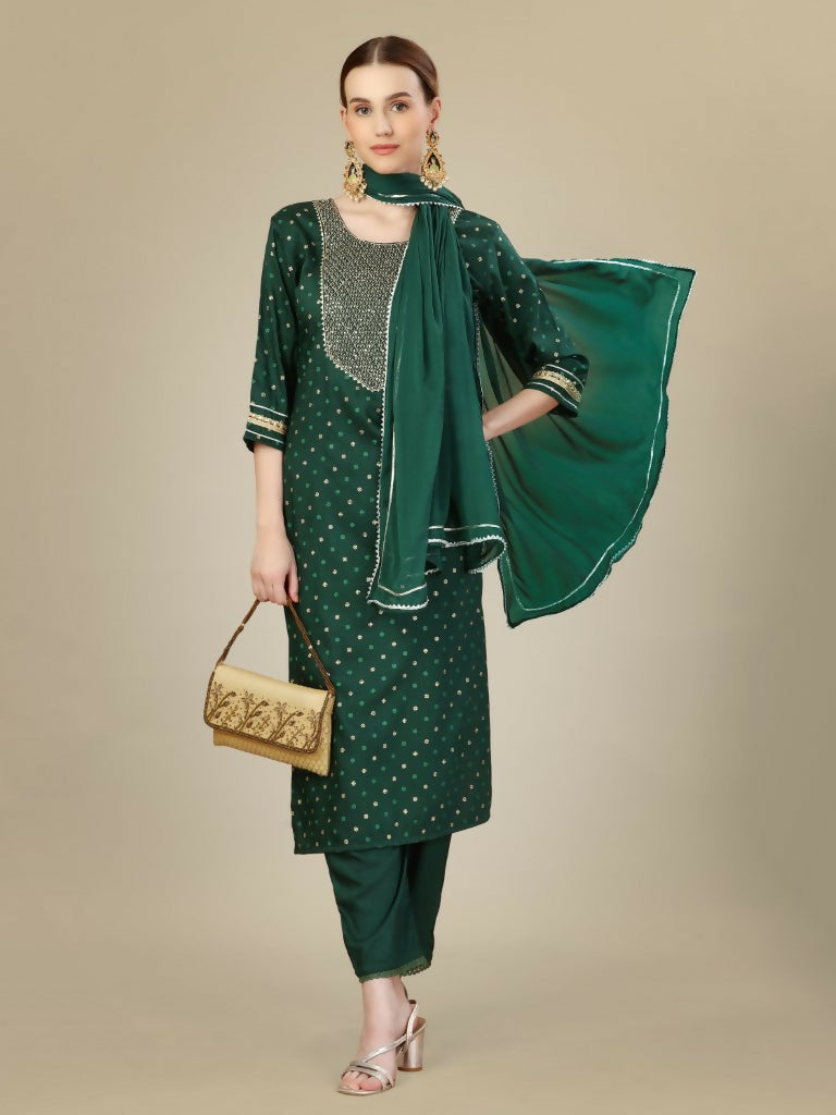 Dark green silk blend kurta set with detailed embroidery and sequence work, paired with trousers and dupatta