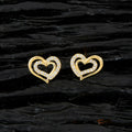 A stunning pair of Golden White AD stone earrings on a neutral background.