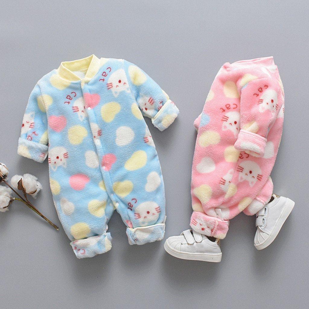Plush, cozy infant jumpsuit with a cartoon animal design available in blue and pink.