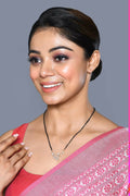 A close-up of a golden white American Diamond Mangalsutra with delicate bead and diamond detailing.
