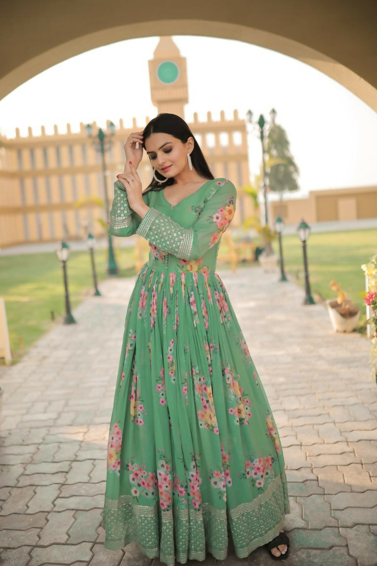 Close up of a green Anarkali dress with digital prints and Zari sequin embroidery