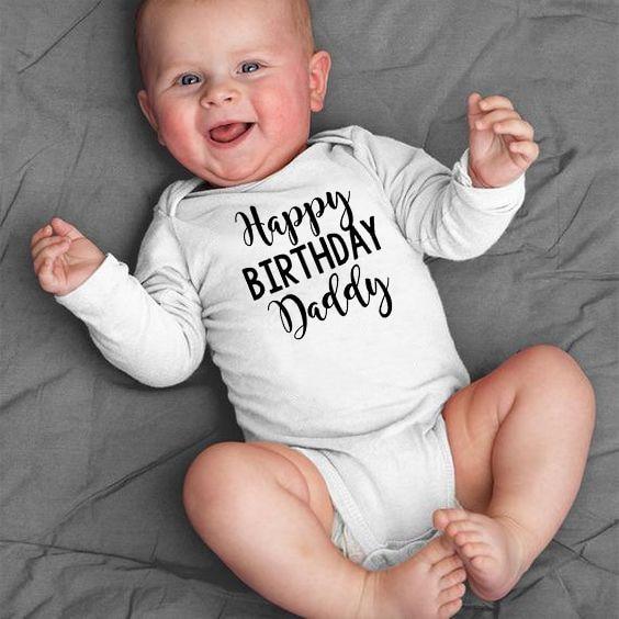 Newborn infant wearing a Happy Birthday Daddy long sleeve jumpsuit