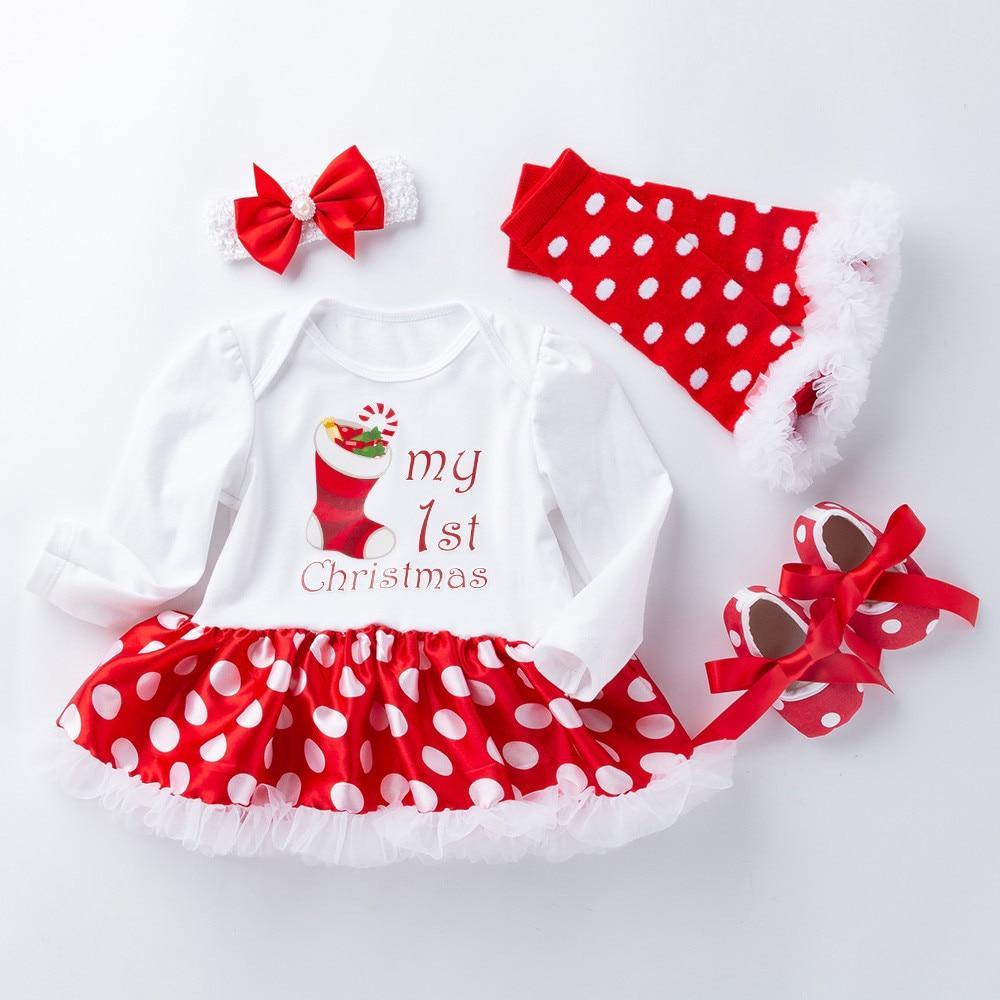 Baby girl wearing a red and white polka dot My 1st Christmas tutu dress set with matching headband and leg warmers.