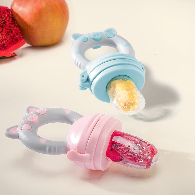 Cartoon animal-themed silicone fruit pacifier feeder for infants in blue, pink, and purple.