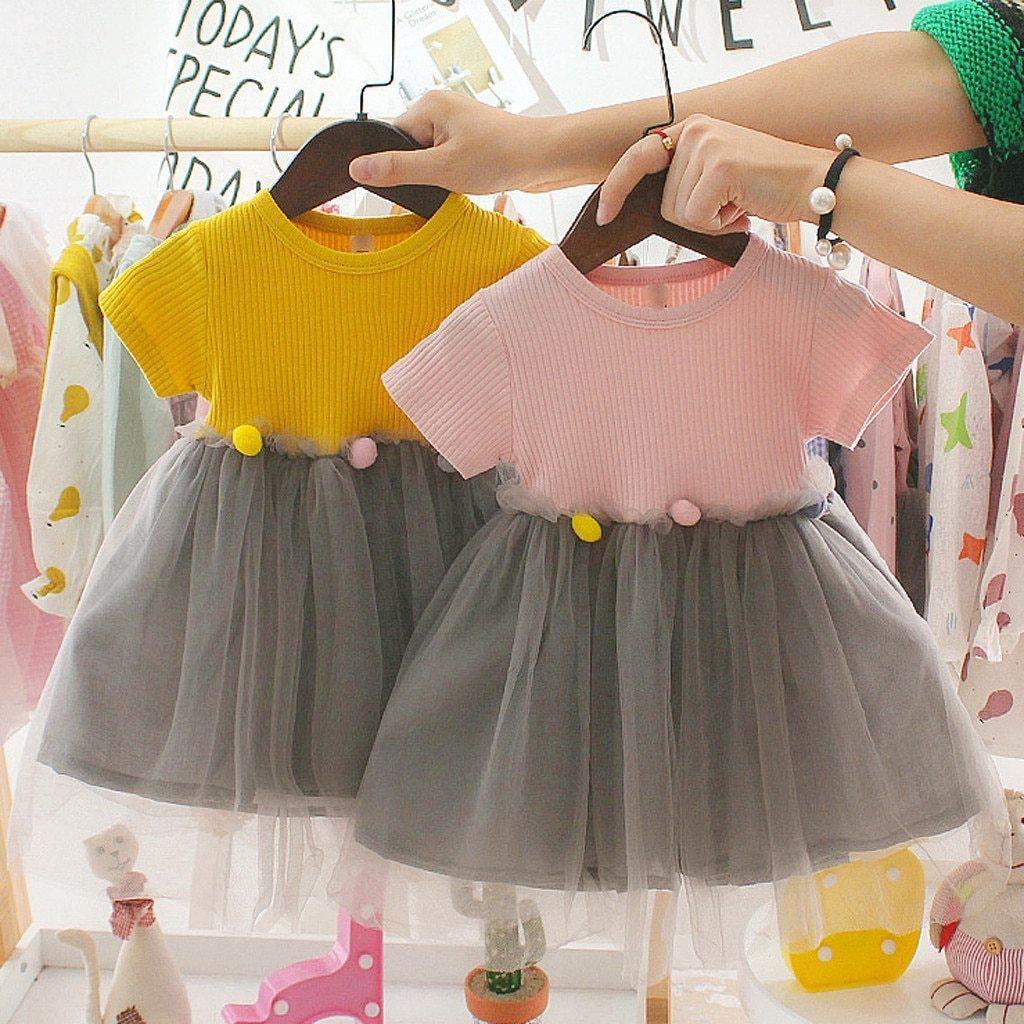 Toddler girl wearing a soft knit bodice tulle princess dress in pastel colors