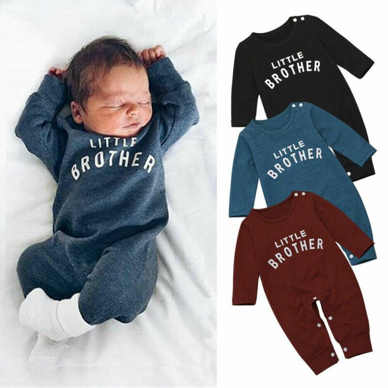 Baby wearing a long sleeve solid knit romper with snap closure in a muted color