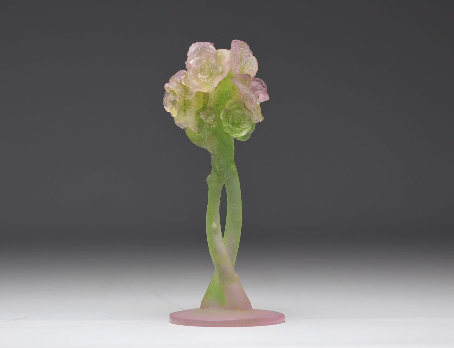 Daum France crystal candlestick holder featuring a sculpted pink and green rose design in its original box.