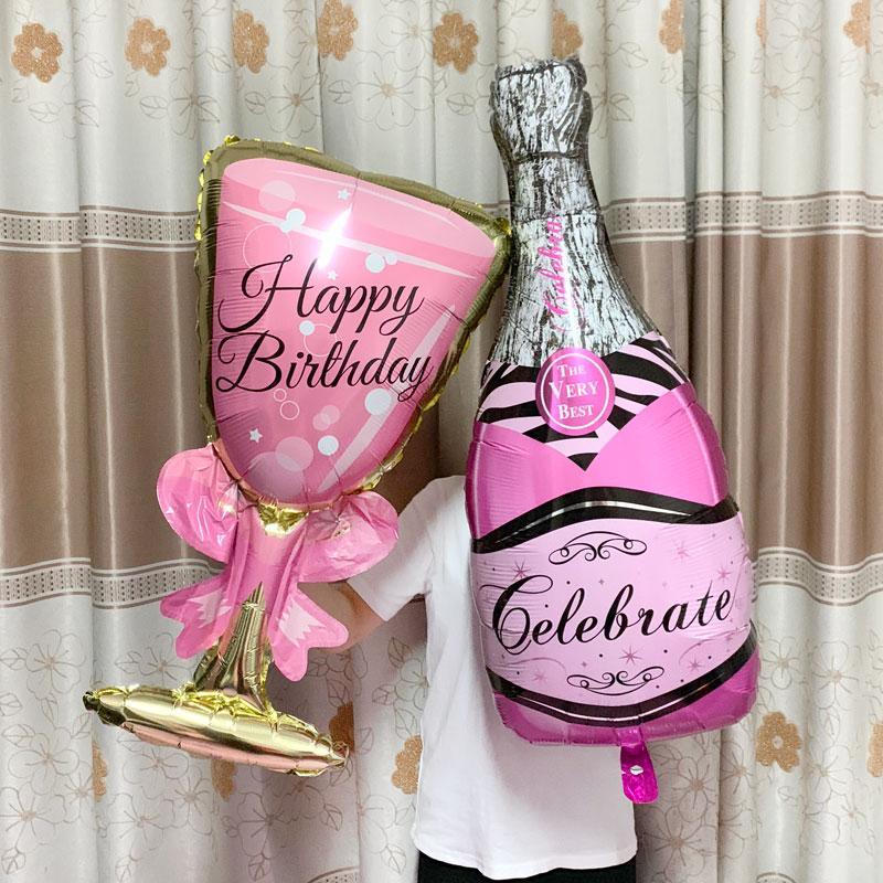 Large champagne bottle and goblet glass balloons for adult and kids birthday party decorations