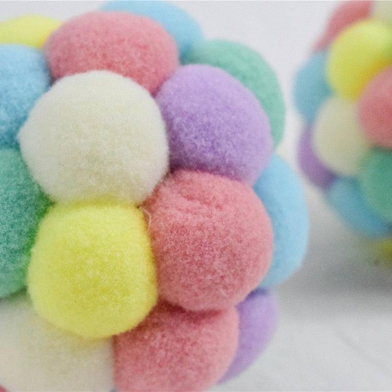 A set of 6 colorful 4cm plush toy balls in pink, yellow, blue, green, purple, and cream for cats and dogs.