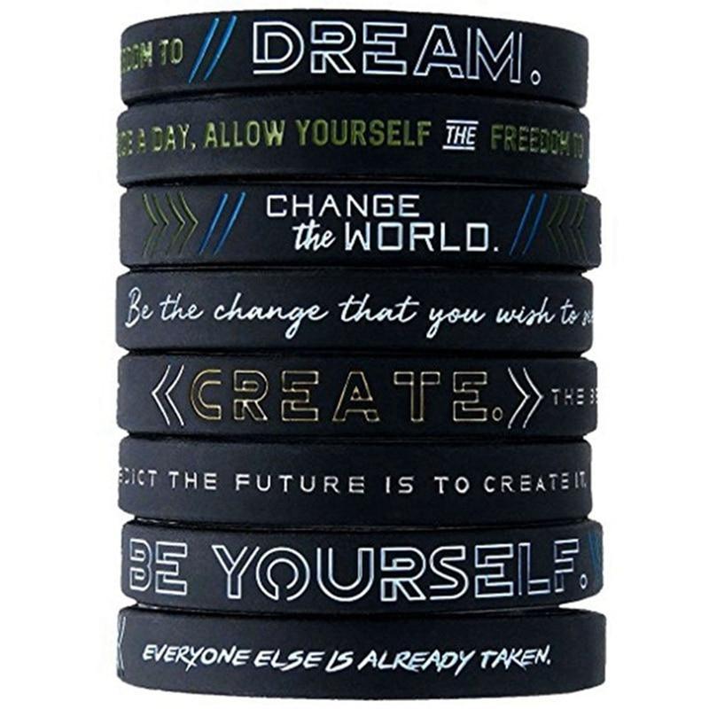 Minimalist black and white motivational silicone wristband for daily wear.