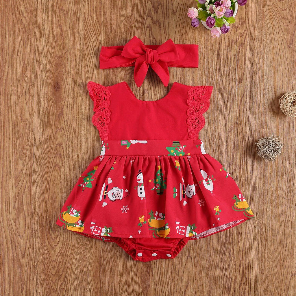 Baby girl wearing a summer lace romper dress with a matching headband and cute cartoon print