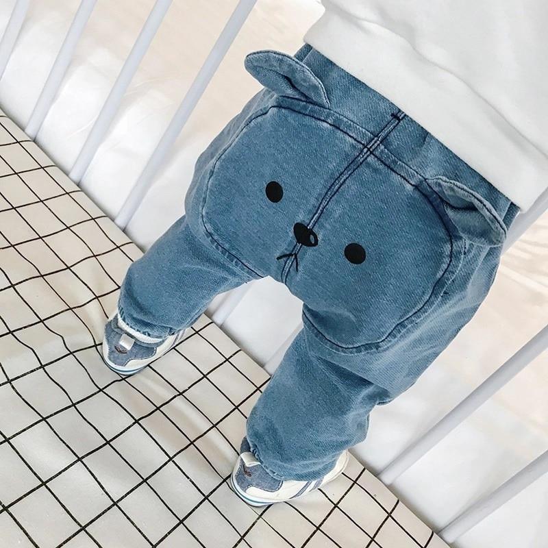 Blue unisex baby pants with playful animal print pattern
