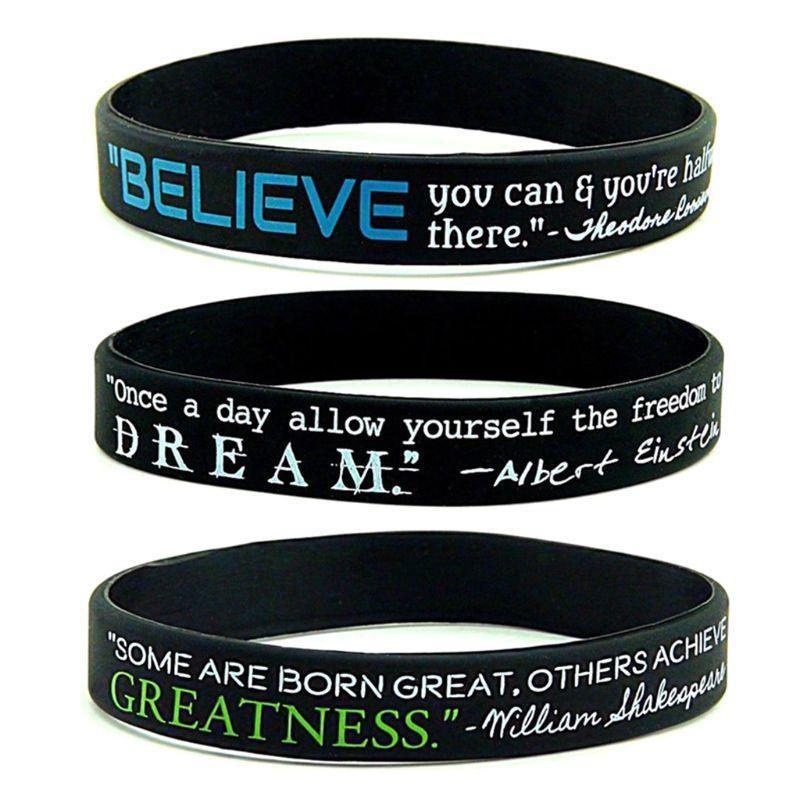 Set of three motivational silicone bracelets with Dream, Believe, and Greatness text