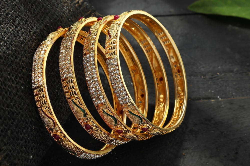Golden AD stone embellished bangle set for women with polished finish
