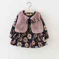 Baby girls 2-piece set featuring a navy floral knit dress and a soft pink faux fur-trimmed coat.