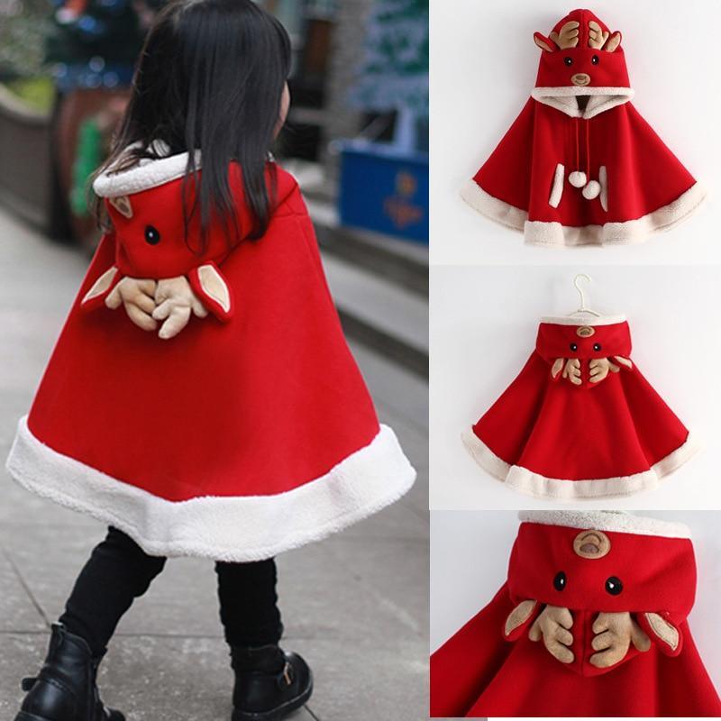 Baby wearing a festive red hooded Christmas reindeer coat with cream-colored sherpa trim