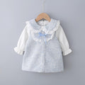 A classic romantic blue and white toddler princess dress with bow detail and removable pearl brooch.