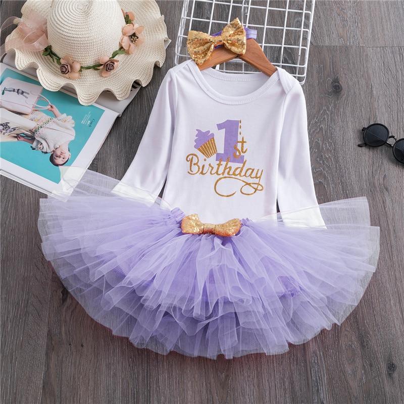 Baby girl long sleeve dress with snowflake print and number 1 for first birthday.