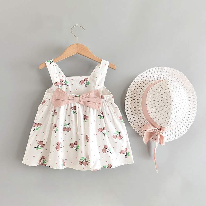 Baby girl wearing a pink and white floral sleeveless princess dress with matching sun hat
