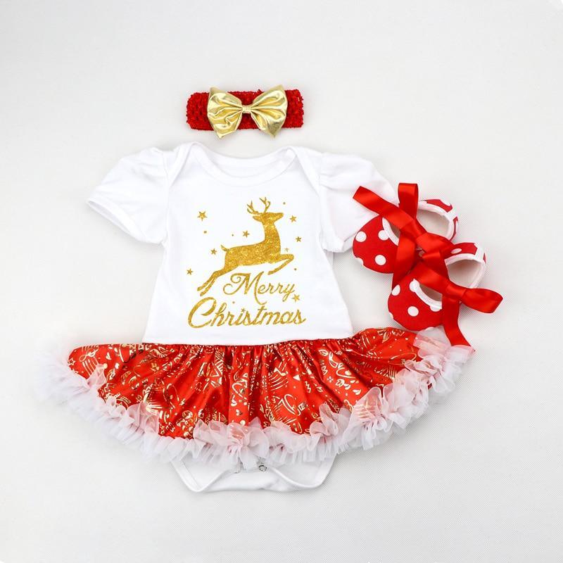 Baby girl wearing a festive white, red, and gold reindeer tutu dress with a matching headband for Christmas.