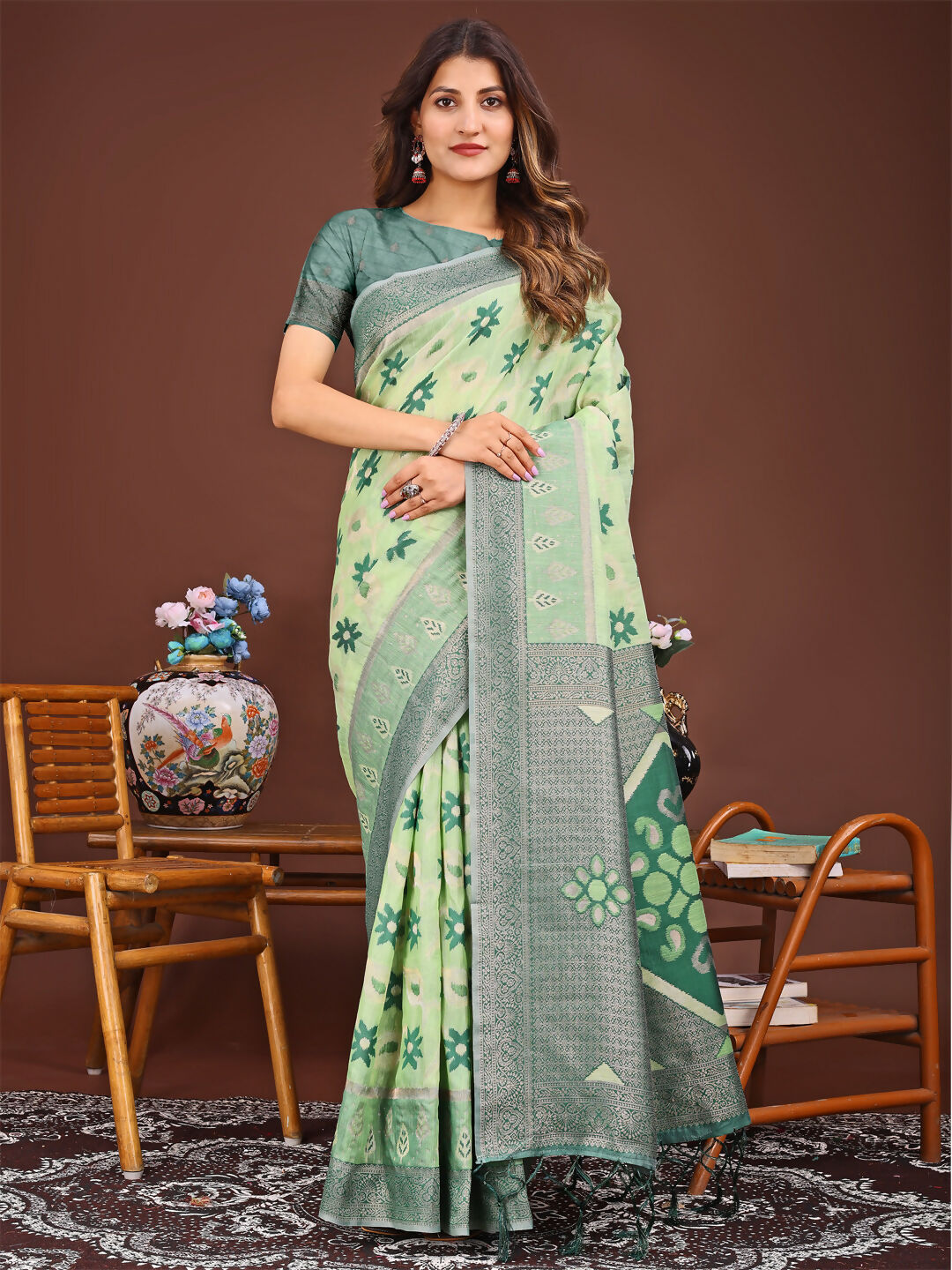 Light green linen cotton saree with natural texture and matching blouse.