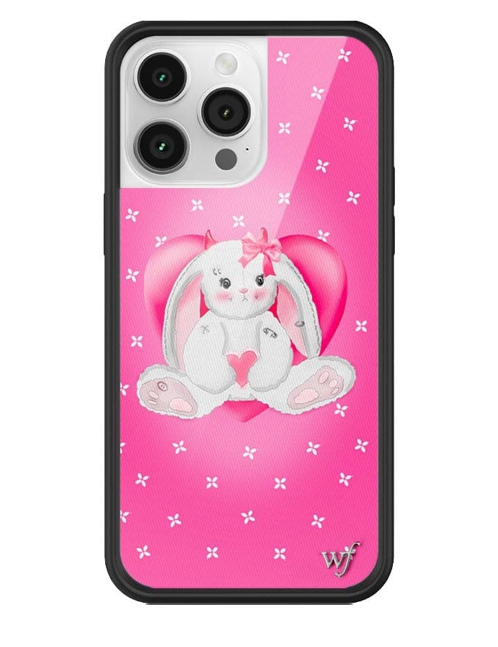 Pink iPhone case with a white bunny character featuring devil ears, studs, and a safety pin design