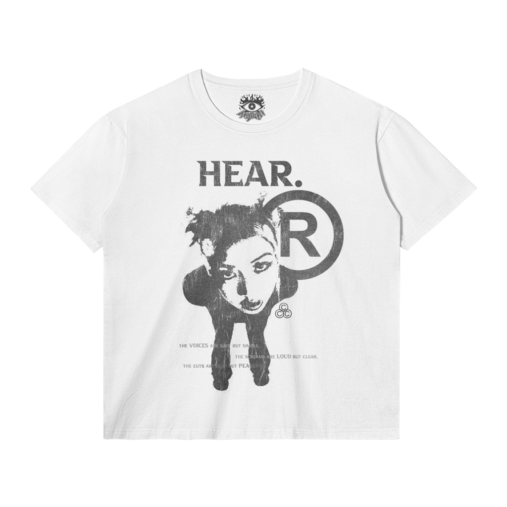 Front view of a white streetwear t-shirt with a HEAR graphic print featuring a person and circular logo
