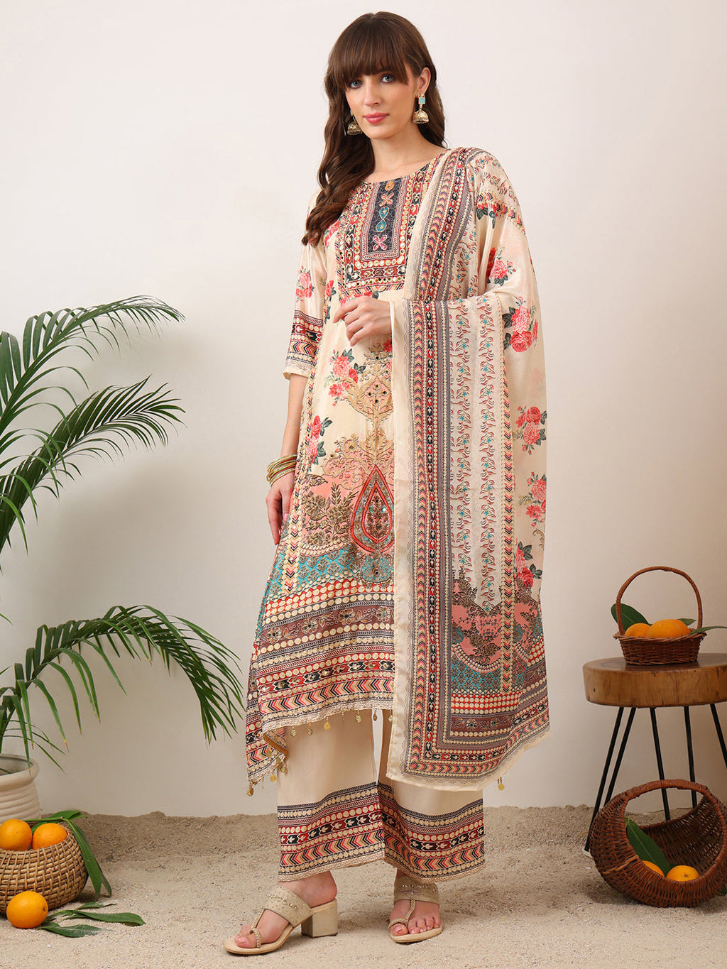 Cream asymmetric kurta set with palazzo and printed dupatta featuring embroidery detailing