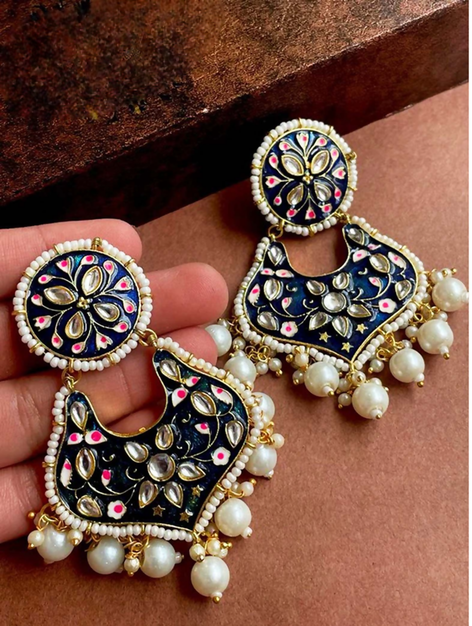 Elegant Meenakari drop earrings with blue stone and bead detailing in gold-tone brass