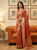 Rust colored tissue silk saree with matching blouse piece
