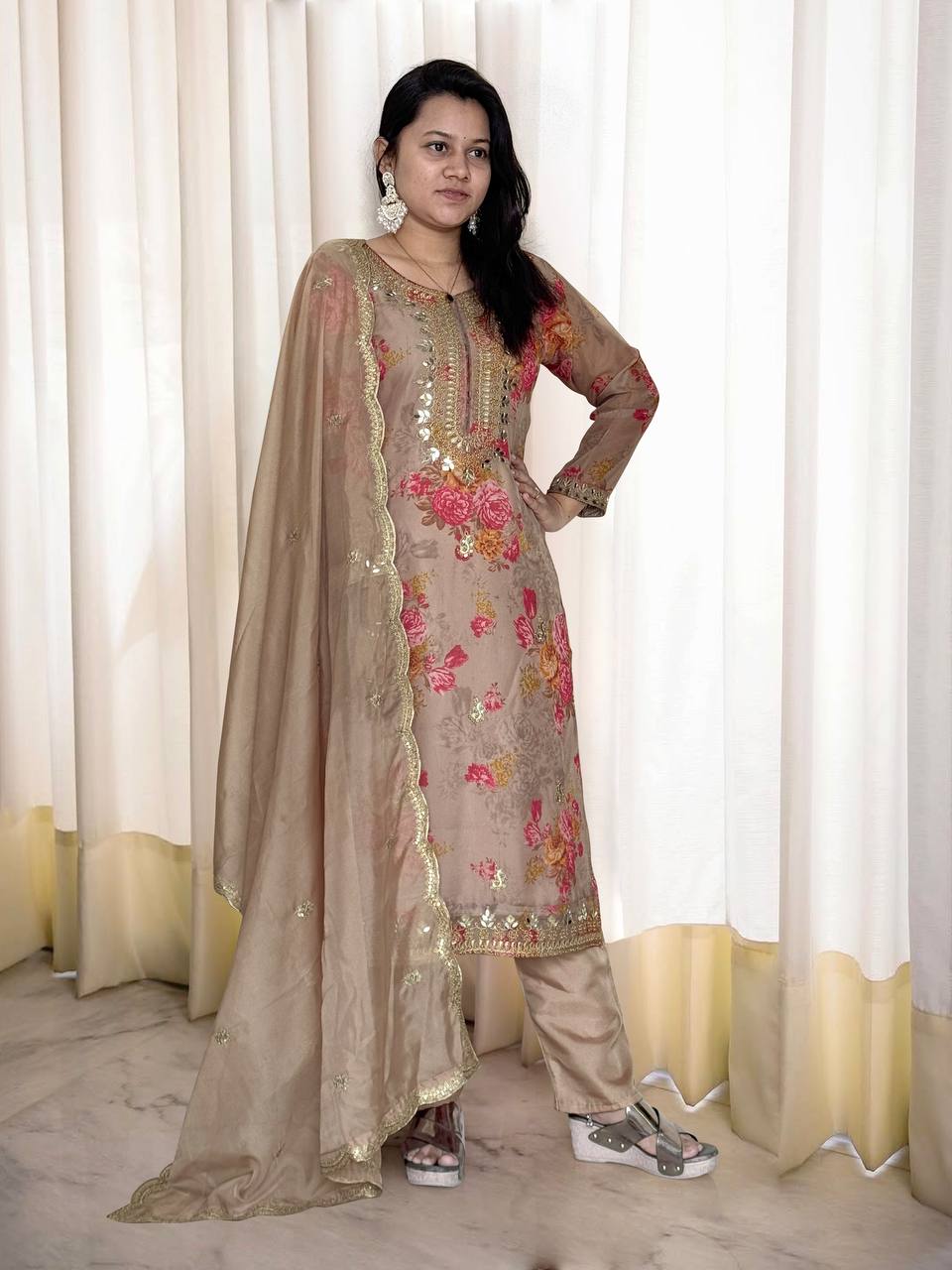 Beige organza salwar suit with heavy mirror, stone, and embroidery work