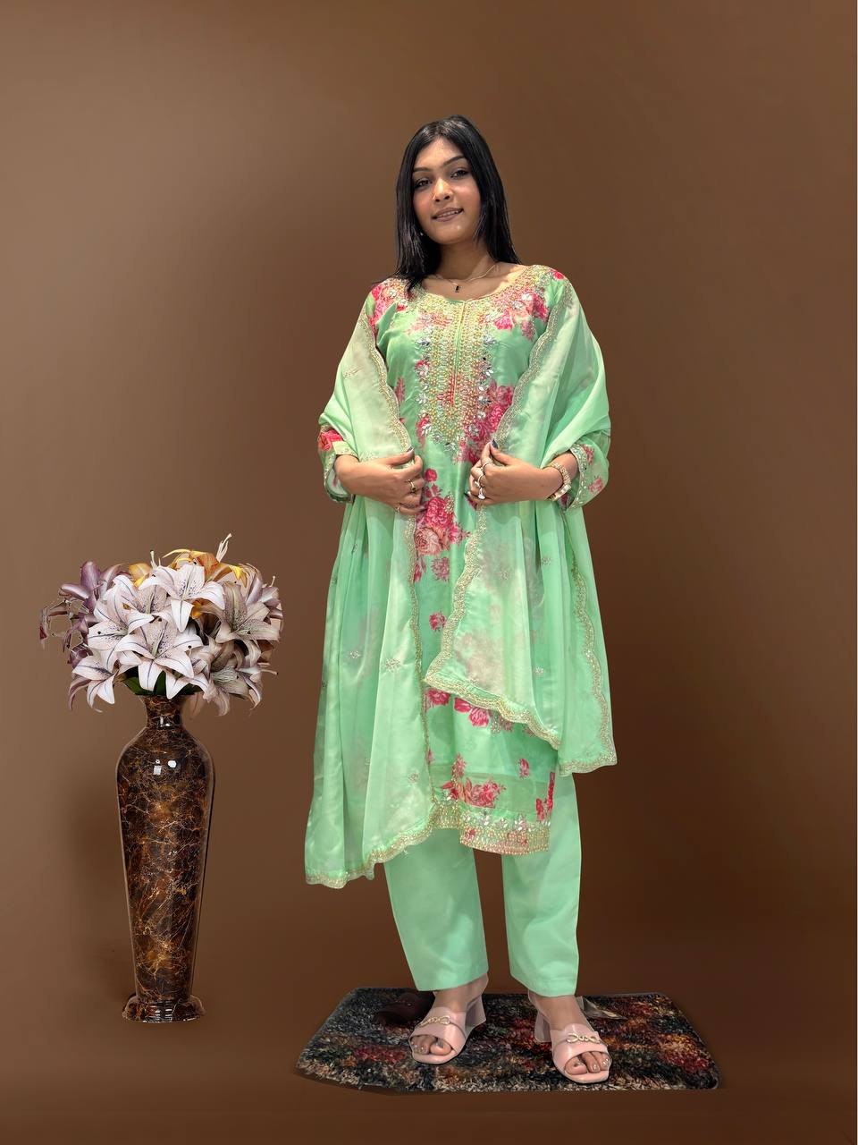 Light Green Organza Salwar Suit with heavy embroidery, stone mirror work, and sequin coding.